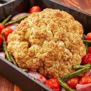 <p>A whole roasted cauliflower makes for a fantastic vegetarian main dish. This one is roasted around extra veggies and has a slightly sweet balsamic glaze over it. It's easy to throw together and will leave you feeling full, not heavy. </p><p>Get the <a href="https://www.delish.com/uk/cooking/recipes/a33948230/balsamic-glazed-roasted-cauliflower-recipe/" rel="nofollow noopener" target="_blank" data-ylk="slk:Balsamic Glazed Roasted Cauliflower;elm:context_link;itc:0;sec:content-canvas" class="link ">Balsamic Glazed Roasted Cauliflower</a> recipe. </p>