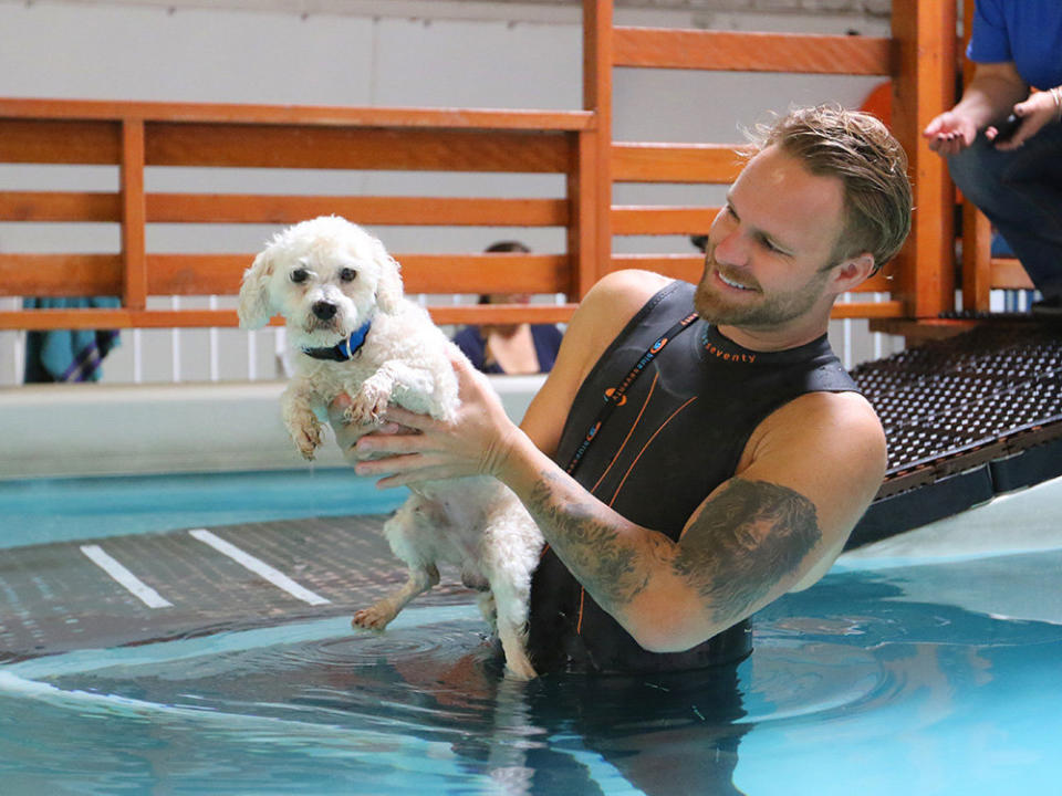 Casteel with Cloud, an affectionate poodle mix who loves squeaky toys