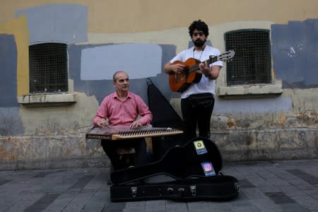 FILE PHOTO: Syrian musicians, refugees from Aleppo, perform in central Istanbul