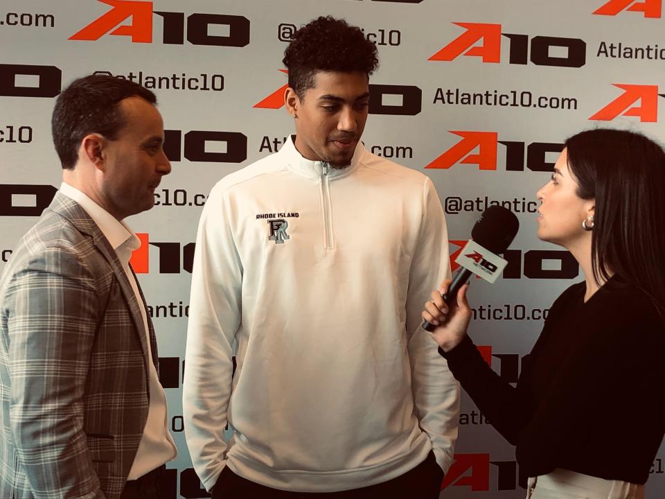 Rhode Island men's basketball coach Archie Miller, left, and new Rams guard Luis Kortright are interviewed at Atlantic 10 Media Day in Brooklyn on Tuesday.