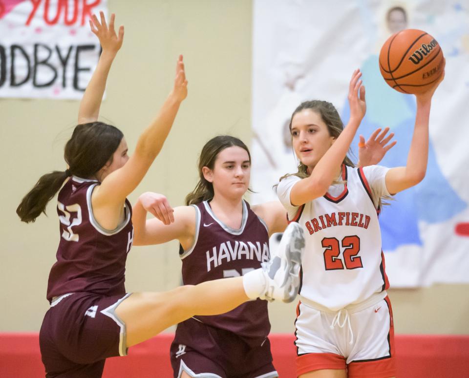 Havana's Kaity Robison, left, and Jaylynn Sarnes, middle, pressure Brimfield's Ava Heinz in the second half Monday, Jan. 23, 2023 at Brimfield High School. The Ducks defeated the Indians 39-31.