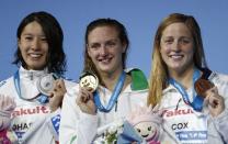 Swimming - 17th FINA World Aquatics Championships - Women's 200m IM awarding ceremony - Budapest, Hungary - July 24, 2017 - Yui Ohashi 0f Japan (silver), Katinka Hosszu of Hungary (gold) and Madisyn Cox of the U.S. (bronze) pose with the medals. REUTERS/Laszlo Balogh