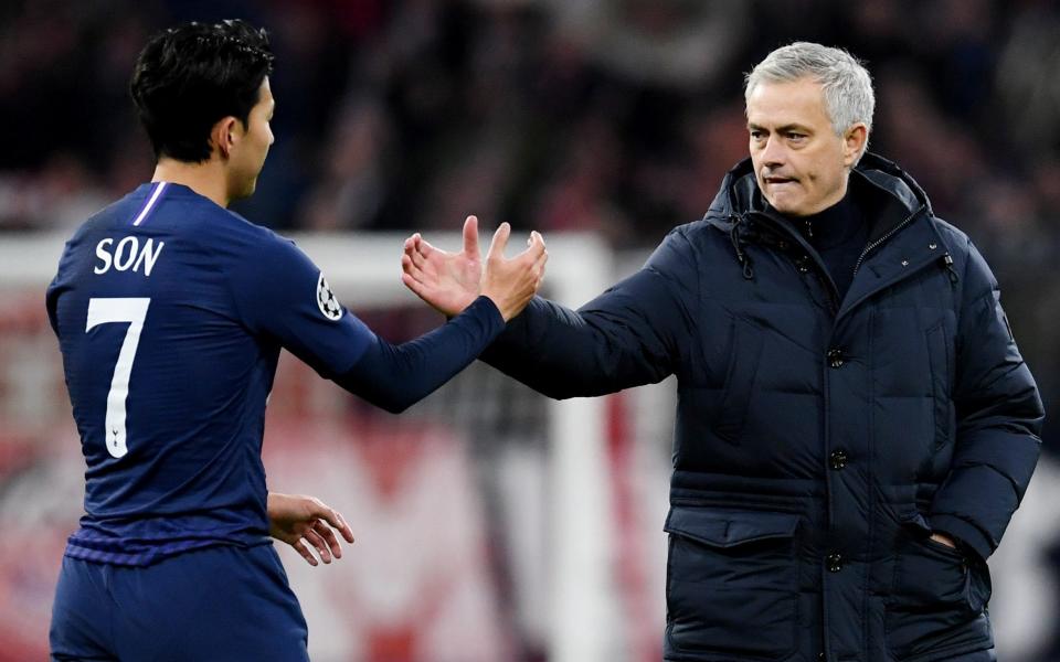 Spurs manager Jose Mourinho shakes hands with midfielder Son Heung-min following their defeat - REUTERS