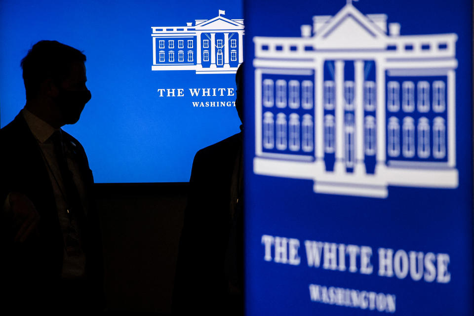 Secret service agents stand near screens before President Joe Biden met virtually with independent farmers and ranches from the White House on Jan. 3, 2022. (Roberto Schmidt / AFP via Getty Images file)