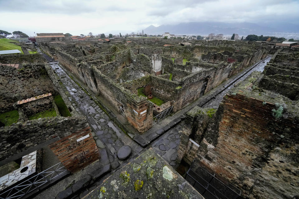 A view of the Pompeii Archeological Park, near Naples, southern Italy, Wednesday, Dec. 14, 2022. One of Pompeii's most famous and richest domus, which contains exceptional works of art and tells the story of the social ascent of two former slaves, is opening its doors to visitors Wednesday, Jan. 11, 2023 after 20 years of restoration. (AP Photo/Andrew Medichini)