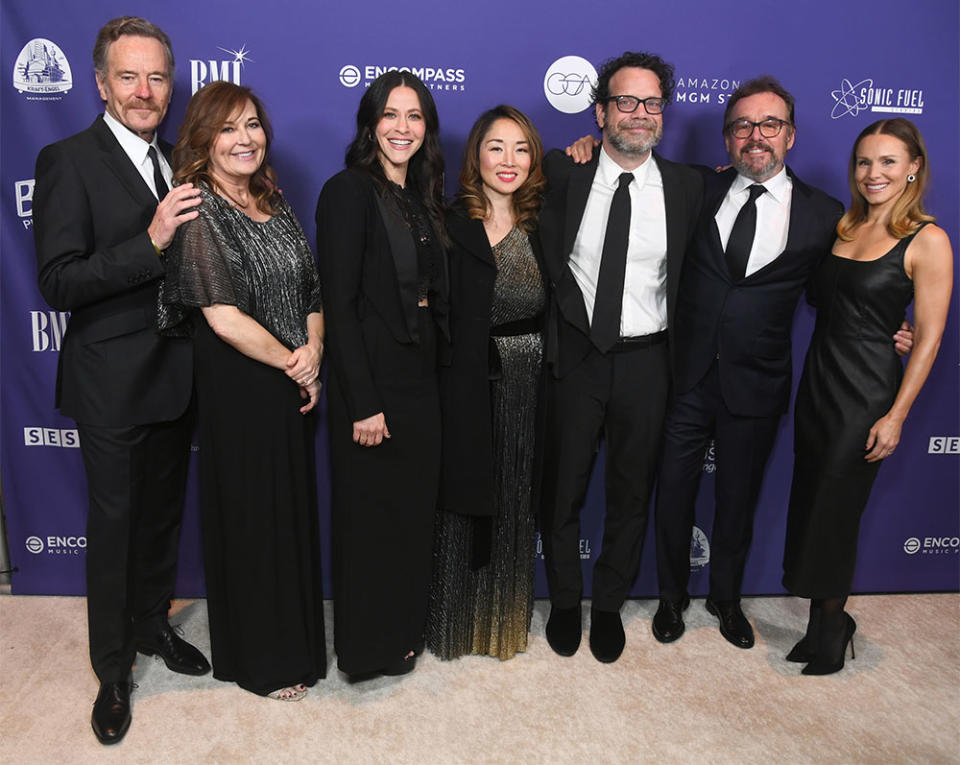 Bryan Cranston, Amy Cranston, Jackie Tohn, Lydia Lee, Christophe Beck, Chris Columbus and Kristen Bell attend the Education Through Music Los Angeles 18th Annual Benefit Gala at Skirball Cultural Center on December 05, 2023 in Los Angeles, California.