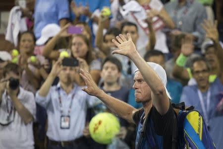 Lleyton Hewitt of Australia waves to fans as he walks off the court following his loss to compatriot Bernard Tomic in their second round match at the U.S. Open Championships tennis tournament in New York, September 3, 2015. REUTERS/Adrees Latif