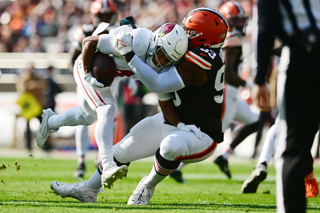 Cleveland Browns defensive tackle Shelby Harris (93) tackles Arizona Cardinals wide receiver Rondale Moore (4) on Nov. 5, 2023, in Cleveland.