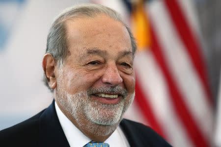 Mexican billionaire Carlos Slim smiles as he attends a ceremony to place the first stone of the new U.S. Embassy in Mexico City, Mexico, February 13, 2018. REUTERS/Edgard Garrido