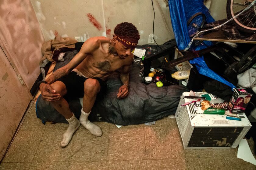 LOS ANGELES, CA - MARCH 10: Juan Smith lives in room that has a door that doesn't close at Sanborn Hotel Apartments on Friday, March 10, 2023 in Los Angeles, CA. (Irfan Khan / Los Angeles Times)