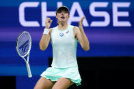 Iga Swiatek, of Poland, reacts after defeating Aryna Sabalenka, of Belarus, during the semifinals of the U.S. Open tennis championships, Thursday, Sept. 8, 2022, in New York. (AP Photo/Frank Franklin II)