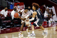 Southern California guard Tahj Eaddy, left, is defended by Washington State guard Isaac Bonton during the second half of an NCAA college basketball game Saturday, Jan. 16, 2021, in Los Angeles. (AP Photo/Ringo H.W. Chiu)