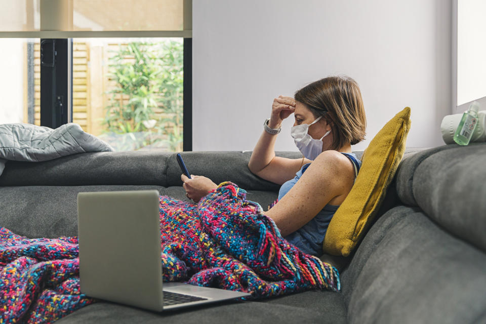 Off work sick but still plugged in to emails from boss. (Getty Images) 