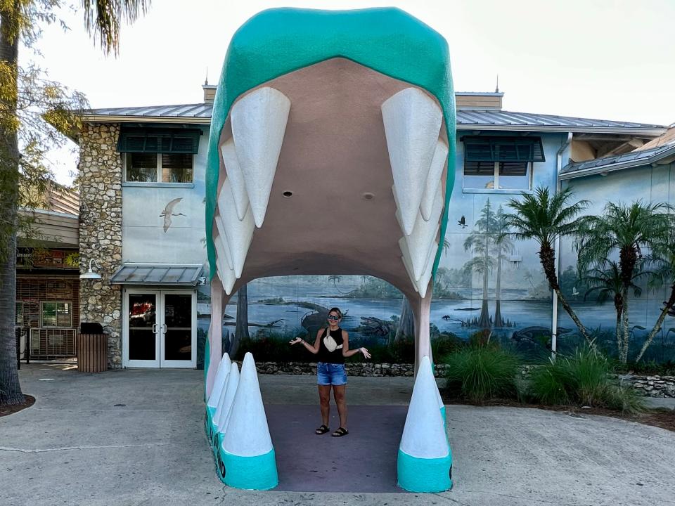Gatorland entrance: A large gator mouth with woman standing inside