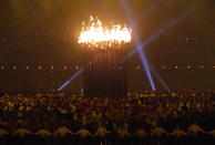 The Olympic cauldron is lit during the Opening Ceremony at the 2012 Summer Olympics, Saturday, July 28, 2012, in London. (AP Photo/Jae C. Hong)