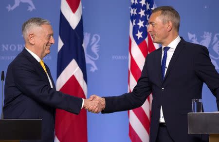 REFILE - CORRECTING BYLINE U.S. Secretary of Defence James Mattis shakes hands with Norwegian Minister of Defense Frank Bakke-Jensen during a press conference at the Ministry of Defence in Olso, Norway, July 14, 2018. NTB Scanpix/Trond Reidar Teigen/via REUTERS