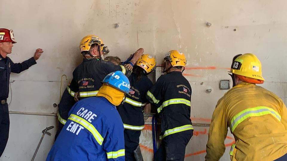 Fire crews working on the rescue. Source: Twitter/@OCFA_PIO