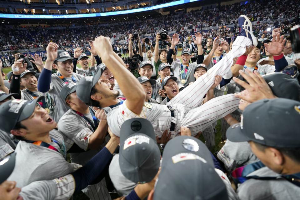 Japan pitcher Yu Darvish (11) celebrates with h