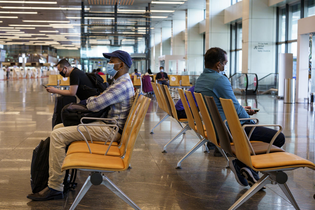 Travellers at Changi Airport Terminal 1 in Singapore.