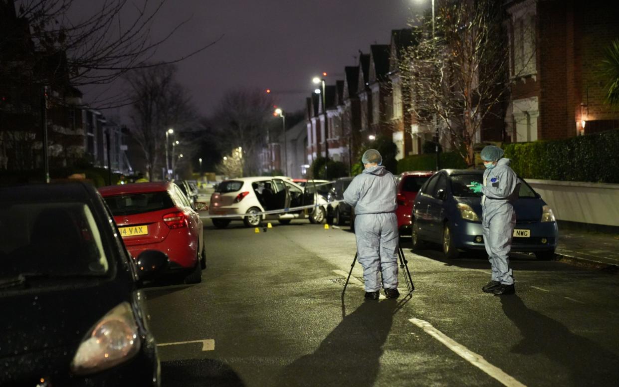 Police at the scene in Lessar Avenue near Clapham Common