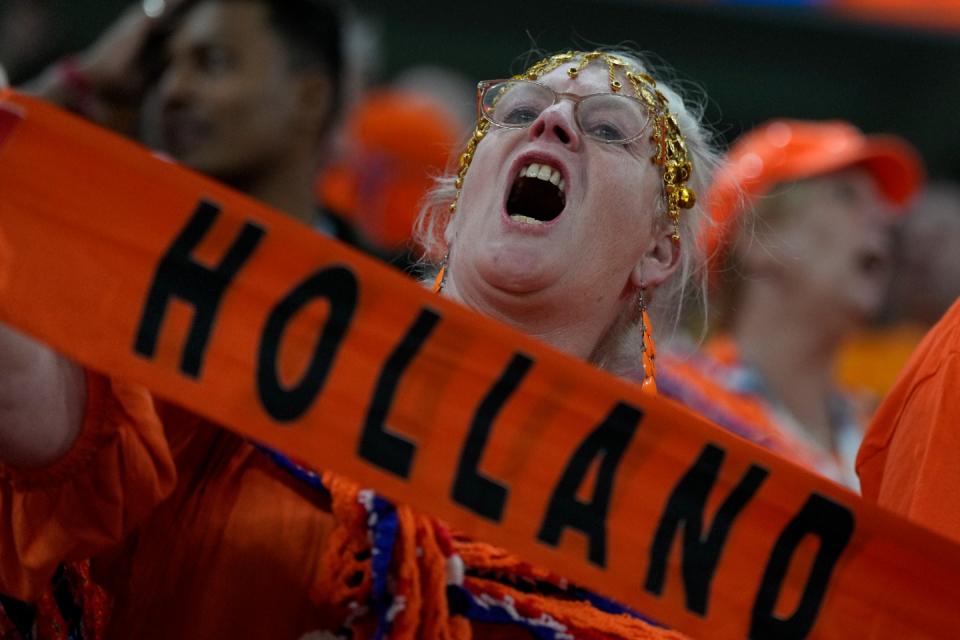 A Dutch supporter cheers before the World Cup, group A football match between Senegal and Netherlands at the Al Thumama Stadium in Doha, Qatar, Monday, Nov. 21, 2022. (AP Photo/Ricardo Mazalan)