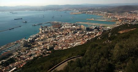 A general view of the British overseas territory of Gibraltar (bottom), the Spanish city of La Linea de la Concepcion (R) and Algeciras Bay are pictured from the Rock, a monolithic limestone promontory, in Gibraltar, south of Spain August 16, 2013. REUTERS/Jon Nazca/File Photo