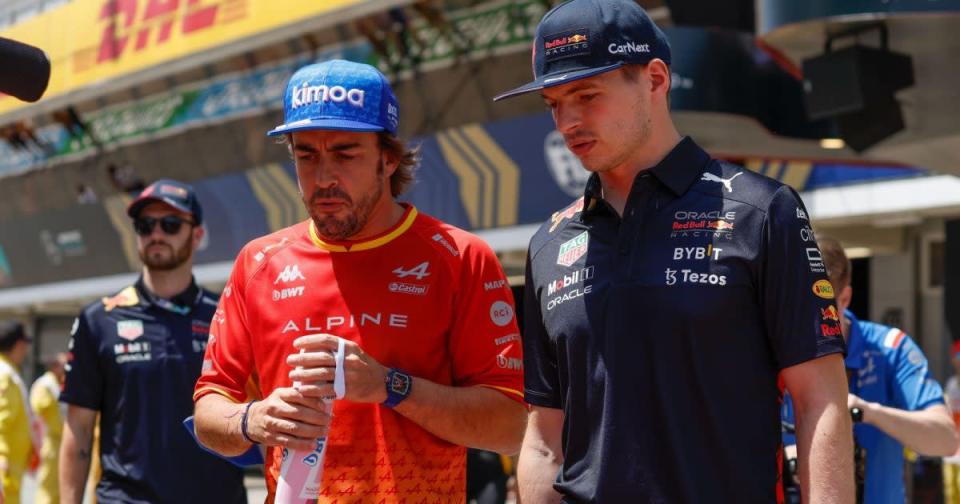 Fernando Alonso speaking to Max Verstappen. Barcelona, May 2022. Credit: PA Images