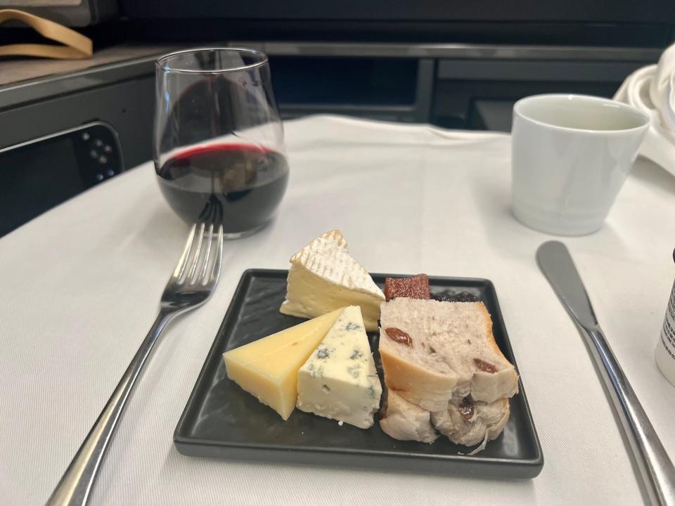 Wine and cheese on my tray table.