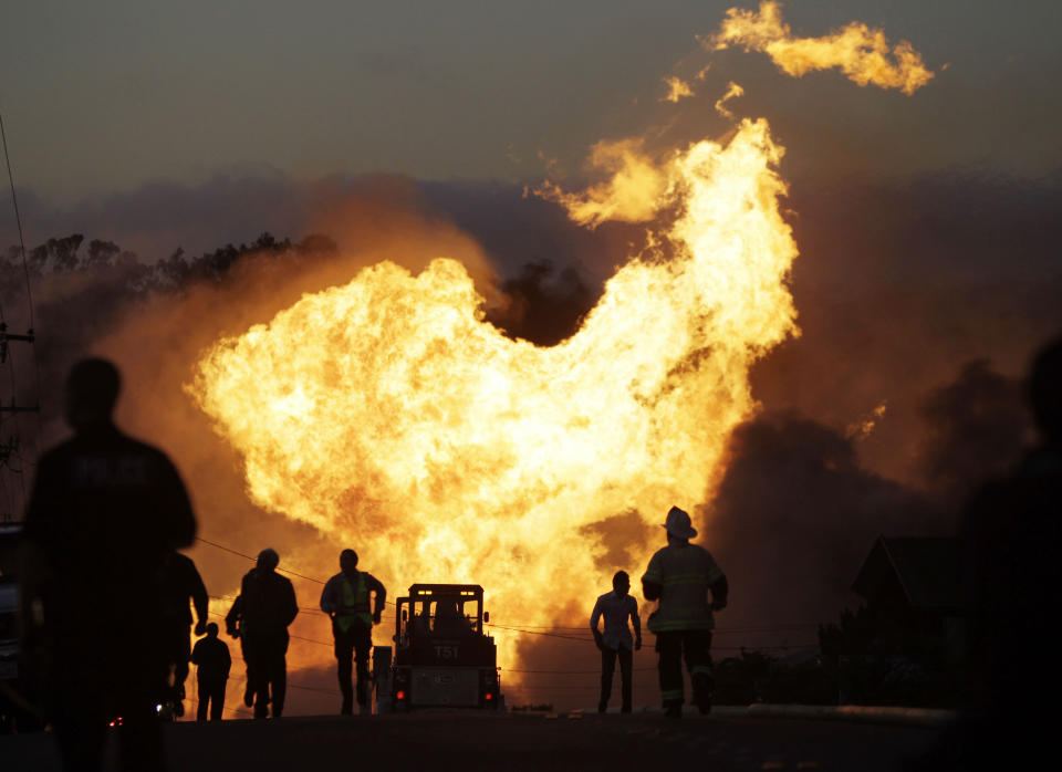 FILE - In this Sept. 9, 2010, file photo, a massive fire roars through a neighborhood in San Bruno, Calif. U.S. transportation officials have finalized long-delayed measures meant to prevent pipeline spills and deadly gas explosions but don't address recommended steps to lessen accidents once they occur. They had been in the works for almost a decade following a massive gas explosion in San Bruno. (AP Photo/Paul Sakuma, File)