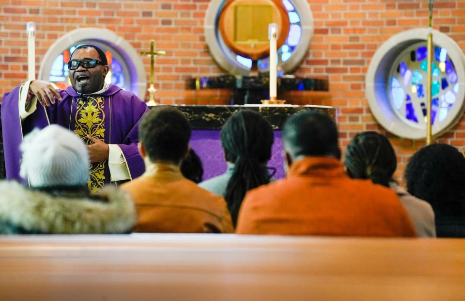 The Rev. Fabrice Kameni preaches to the congregation in French during the French-language Catholic Mass at Holy Family Parish on Sunday, Feb. 25, 2024. It was the first time the small community of francophone African immigrants met at the Whitefish Bay church. Prior to that, they were at St. Rose of Lima.