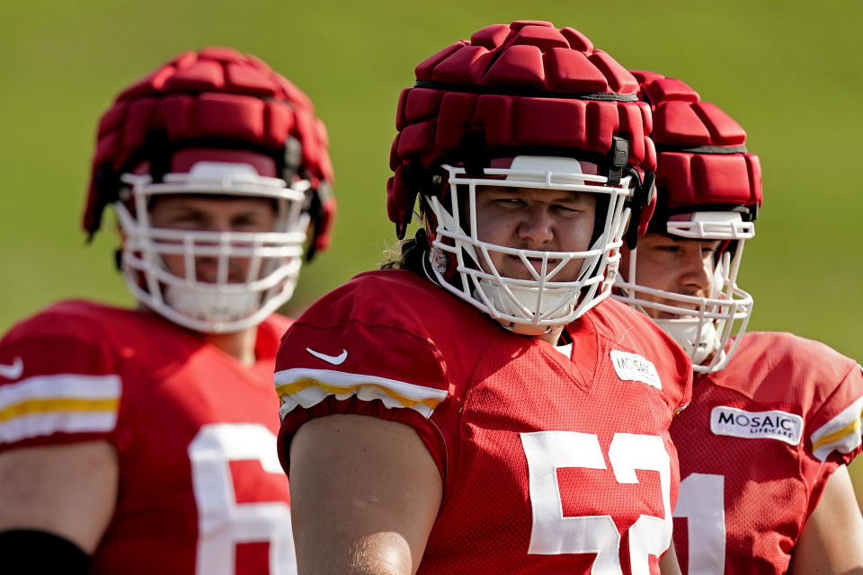Kansas City Chiefs center Creed Humphrey, center, waits to practice during NFL football training camp Monday, Aug. 1, 2022, in St. Joseph, Mo. (AP Photo/Charlie Riedel)