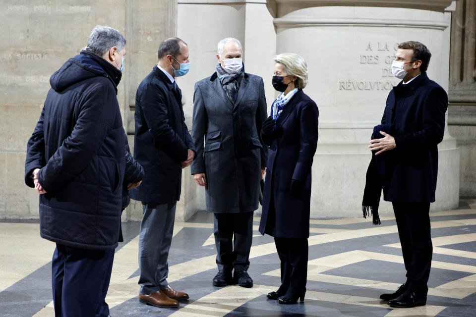 France's President Emmanuel, right, and European Commission President Ursula von der Leyen, second from right, greet Veil's sons and Monnet's grand-son during a ceremony to pay tribute to late French politician Simone Veil and diplomat Jean Monnet at the French Pantheon in Paris, Friday, Jan. 7, 2022. French president Emmanuel Macron paid a tribute to a pair of leading European figures Friday as France formally took the reins of the 27-nation bloc for the next six months with big ambitions. (Ludovic Marin, Pool Photo via AP)