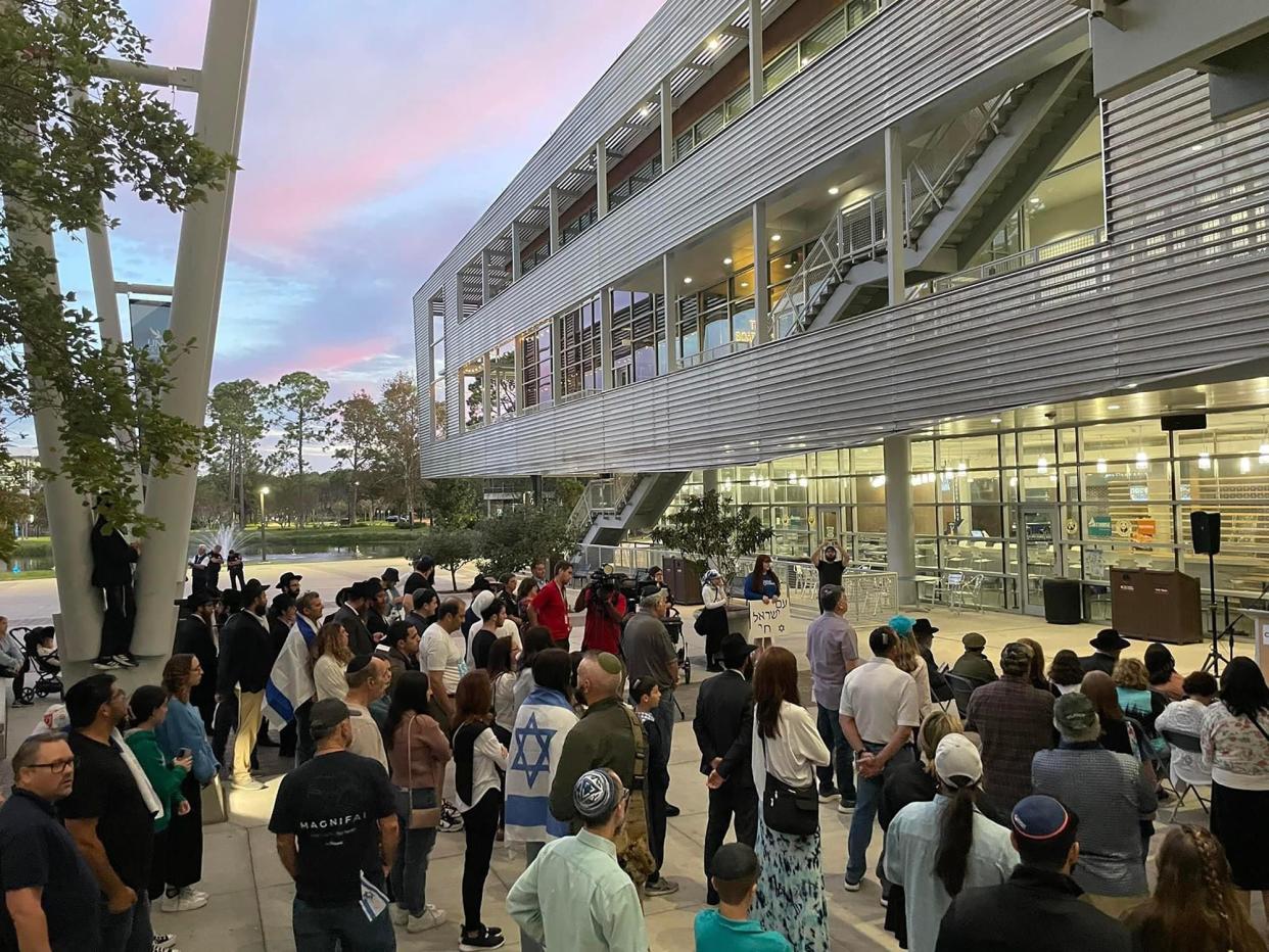 The community gathers for Monday's prayer vigil by Jacksonville's Chabad of Southside and the University of North Florida for Jewish victims of the Hamas attack on Israel.