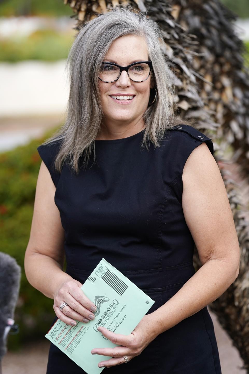 Arizona Democratic candidate for Governor Katie Hobbs speaks to the media before dropping off her primary election ballot Tuesday, July 21, 2022, in Scottsdale, Ariz. (AP Photo/Ross D. Franklin)