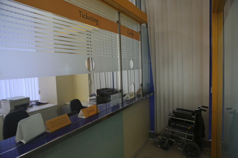 A Jet airways ticketing counter is seen deserted at the company's headquarters in Mumbai, India Thursday, April 18, 2019. Jet Airways, once India's largest airline, announced on Wednesday that it is suspending all operations after failing to raise enough money to run its services. (AP Photo/Rafiq Maqbool)