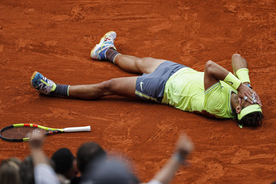 FILE - In this June 9, 2019, file photo, Spain's Rafael Nadal celebrates his record 12th French Open tennis tournament title, after winning the men's final against Austria's Dominic Thiem in four sets, 6-3, 5-7, 6-1, 6-1, at Roland Garros stadium in Paris. Nadal will be competing in the 2019 Wimbledon tournament.(AP Photo/Jean-Francois Badias, File)