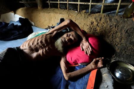 A Rohingya refugee man lies at his shelter in Kutupalong refugees camp in Cox's Bazar, Bangladesh, October 20, 2017. REUTERS/ Zohra Bensemra