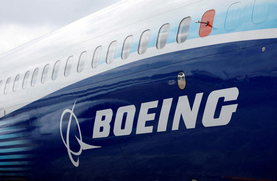 FILE PHOTO: The Boeing logo is seen on the side of a Boeing 737 MAX at the Farnborough International Airshow, in Farnborough, Britain, July 20, 2022.  REUTERS/Peter Cziborra/File Photo/File Photo