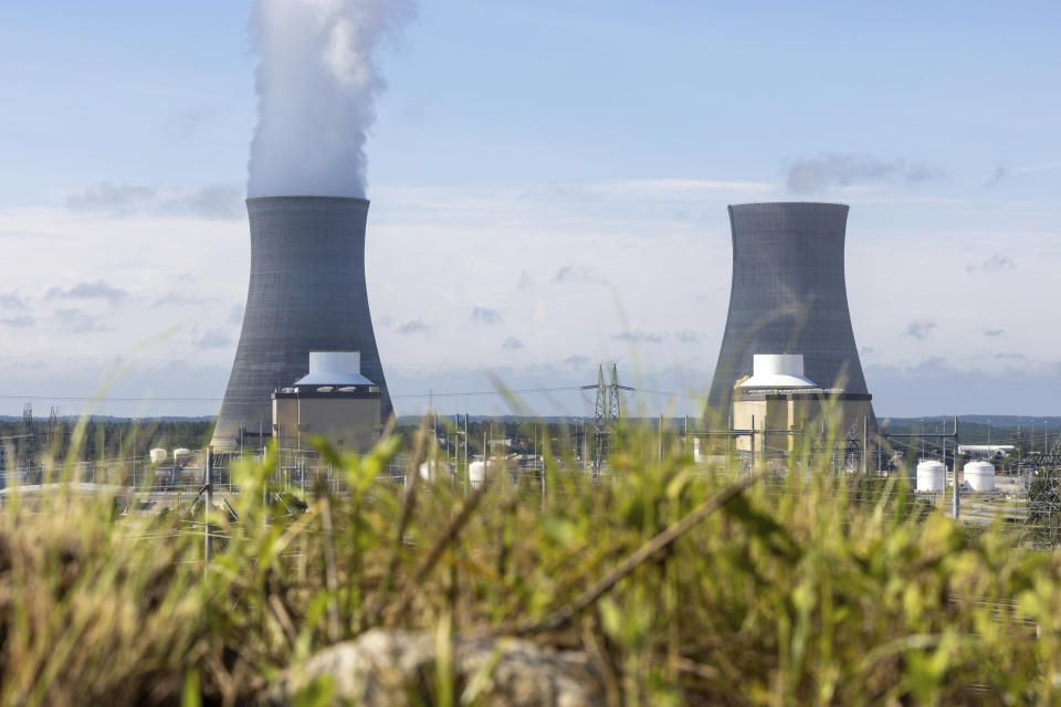 Views of units 3, from left, and 4 at Plant Vogtle, in Burke County near Waynesboro, Ga., on Monday, July 31, 2023. Georgia Power Co. announced Monday that Unit 3 at Plant Vogtle, southeast of Augusta, has completed testing and is now in commercial operation, seven years late and $17 billion over budget. (Arvin Temkar/Atlanta Journal-Constitution via AP)