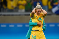 <p>Alanna Kennedy of Australia is embraced after their 0-0 (6-7 PSO) loss to Brazil during the Women’s Football Quarterfinal match at Mineirao Stadium on Day 7 of the Rio 2016 Olympic Games on August 12, 2016 in Belo Horizonte, Brazil. (Photo by Pedro Vilela/Getty Images) </p>