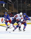 New York Rangers' Ryan Strome (16) holds back Washington Capitals' Tom Wilson (43) during the first period of an NHL hockey game Wednesday, May 5, 2021, in New York. (Bruce Bennett/Pool Photo via AP)