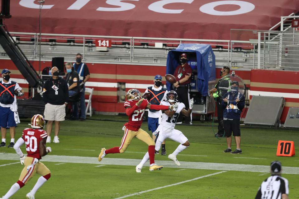 Philadelphia Eagles wide receiver Travis Fulgham (13) catches a touchdown pass in front of San Francisco 49ers cornerback Dontae Johnson.