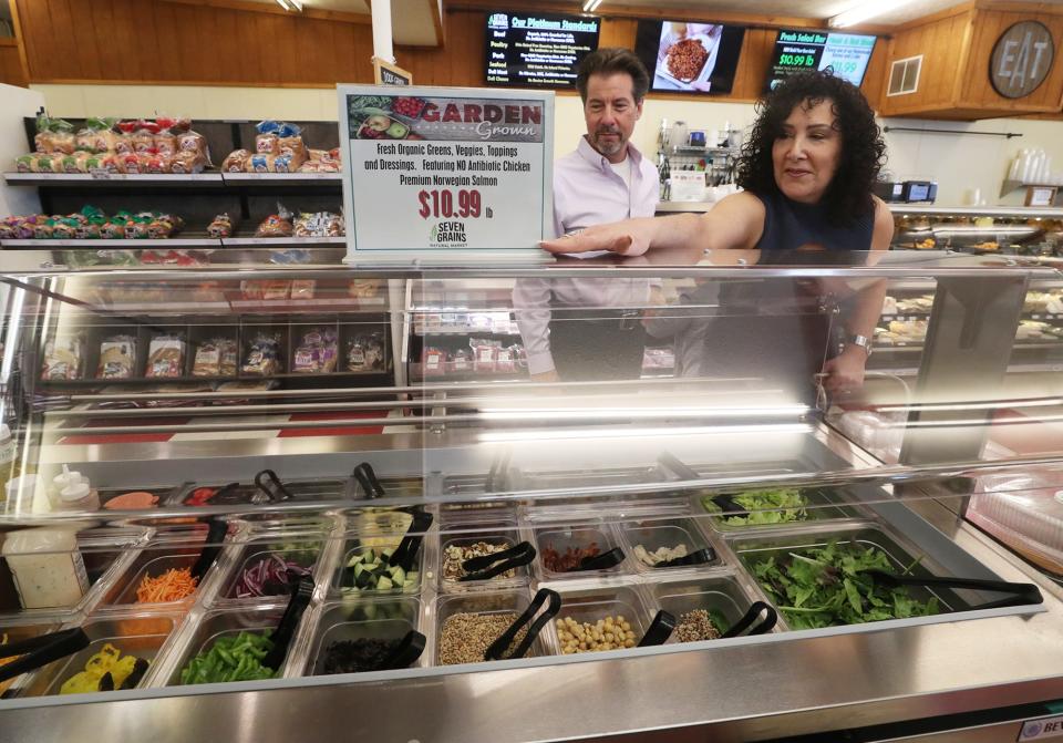 David and Gina Krieger, owners of Seven Grains Natural Market, talk about the salad bar at their store in Tallmadge.