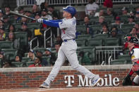 Los Angeles Dodgers' Freddie Freeman (5) hits a three-run home run as Atlanta Braves catcher Sean Murphy, right, looks on in the fifth inning of a baseball game, Monday, May 22, 2023, in Atlanta. (AP Photo/John Bazemore)