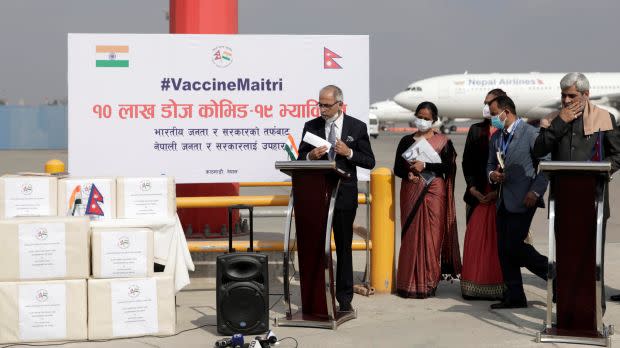 Nepal's Minister for Health and Population Hridayesh Tripathi and Indian ambassador to Nepal Vinay Mohan Kwatra attend the vaccine handover ceremony upon the arrival of the first batch of COVID-19 vaccines provided by the Government of India as a grant to Nepal, at Tribhuvan International Airport in Kathmandu, Nepal