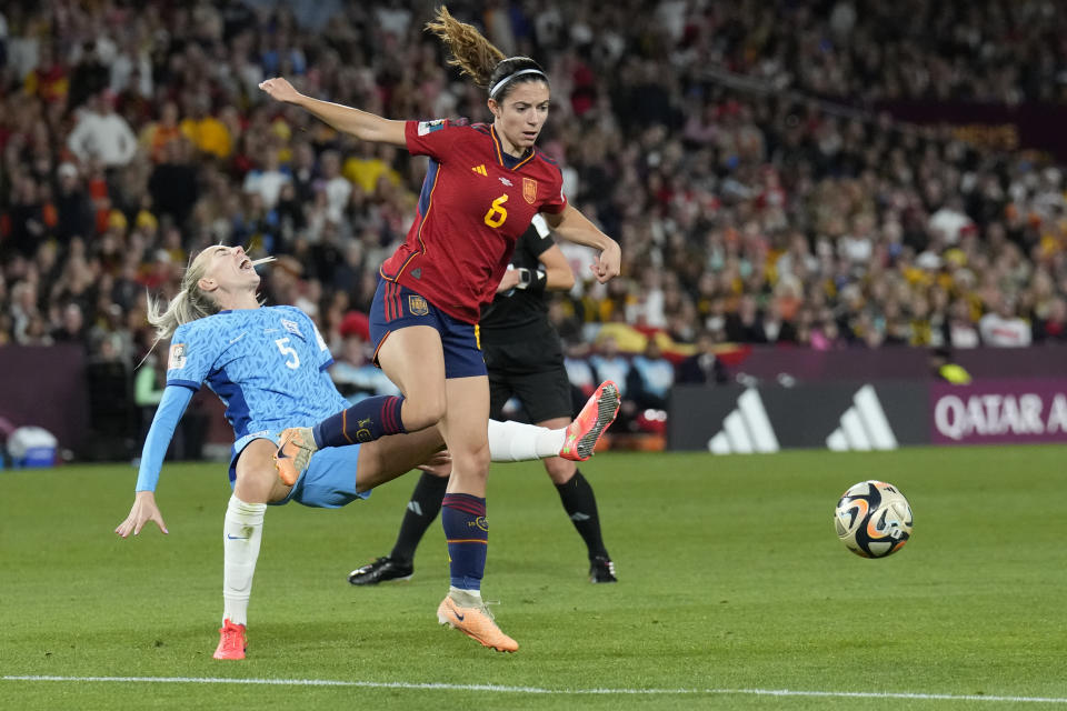 Spain's Aitana Bonmati, right, challenges for the ball with England's Alex Greenwood during the Women's World Cup soccer final between Spain and England at Stadium Australia in Sydney, Australia, Sunday, Aug. 20, 2023. (AP Photo/Alessandra Tarantino)