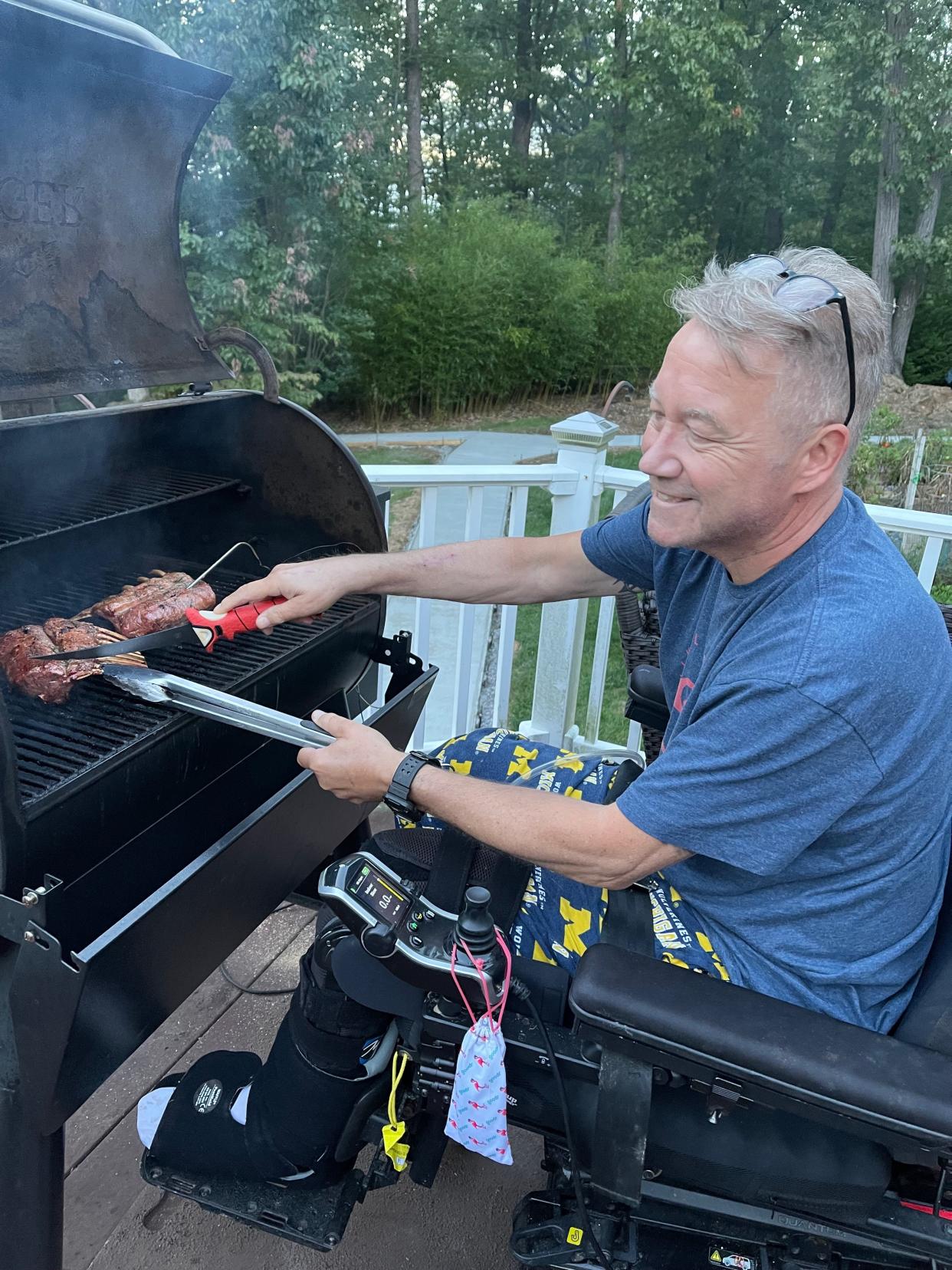 Even after a June 2021 crash that left Scott Spitnale with severe injuries, he still enjoys grilling at his Keedysville home.