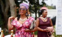 Guests arrive to watch a TV broadcast of Britain's Prince Harry and Meghan Markle's royal wedding at the Windsor golf and country club in Nairobi, Kenya May 19, 2018. REUTERS/Thomas Mukoya