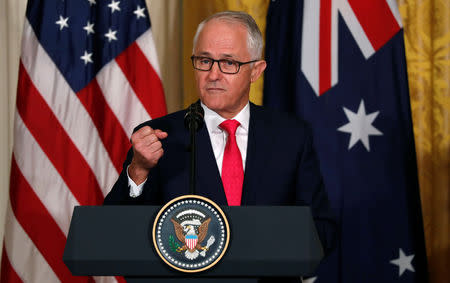 FILE PHOTO: Australian Prime Minister Malcolm Turnbull gestures during a joint news conference with U.S. President Donald Trump (not pictured) at the White House in Washington, U.S., February 23, 2018. To match Special Report HUAWEI-USA/CAMPAIGN REUTERS/Jonathan Ernst/File Photo