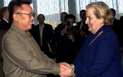 Former North Korean Leader Kim Jong Il, left, shakes hands with US Secretary of State Madeleine Albright  - Credit: AP Photo/David Guttenfelder, Pool, File